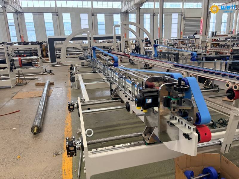 https://www.wd-cartonmachine.com/automatic-corrugated-box-folder-gluer-stitcher-machine-product/