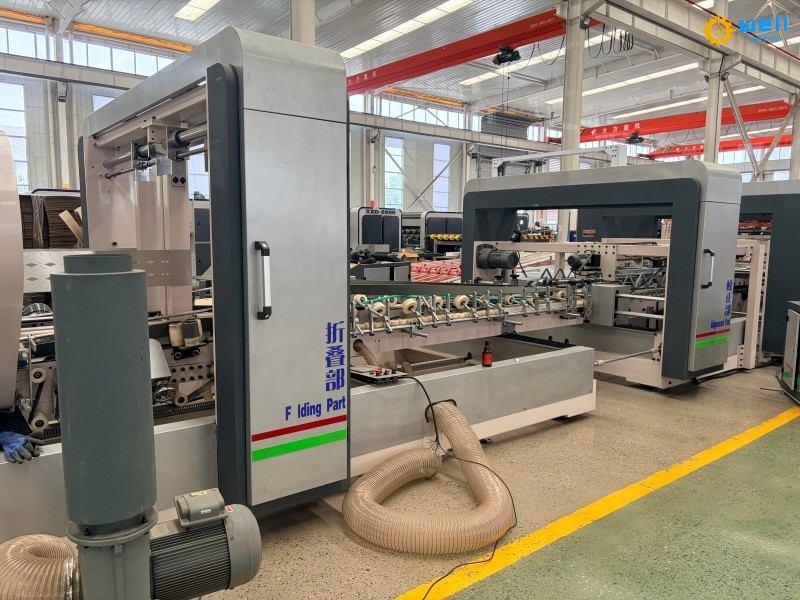 https://www.wd-cartonmachine.com/automatic-carton-box-folder-gluer-stitching-machinery-supplier-product/